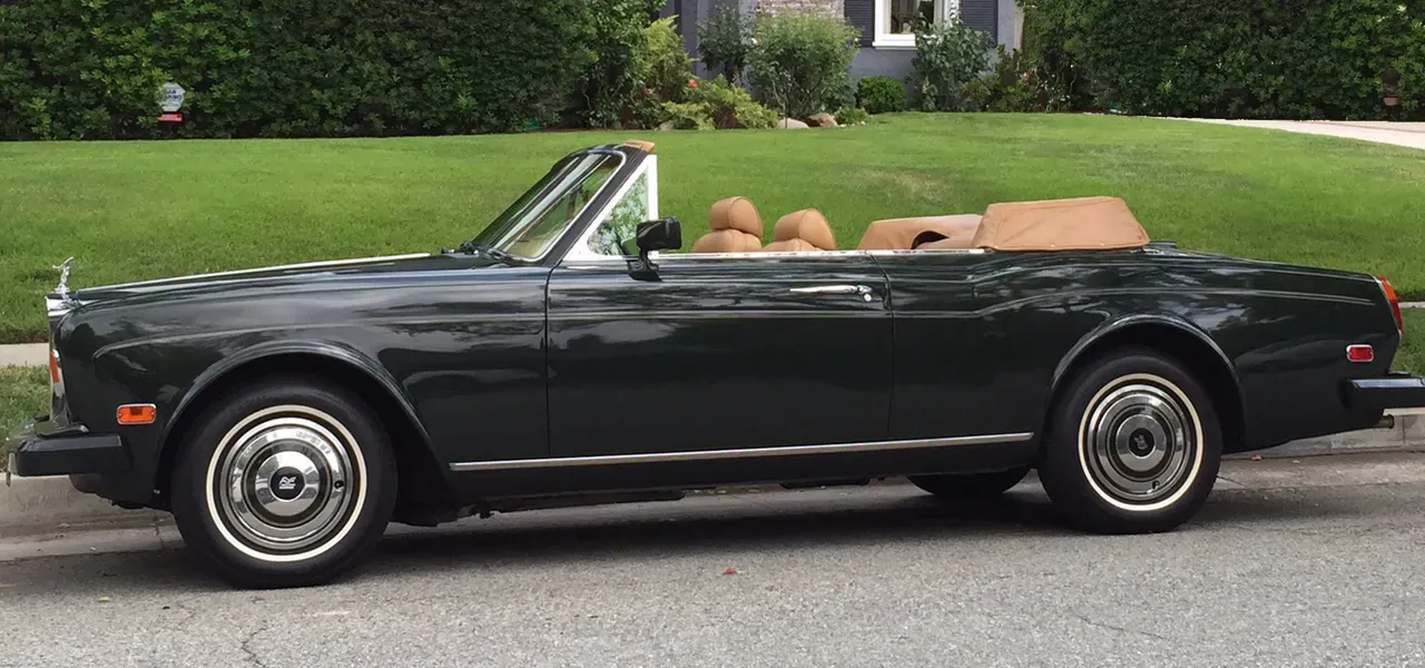Green 1983 Rolls-Royce Corniche Convertible exterior with convertible roof, photo 11 for wedding car rental