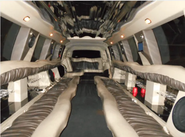 Cadillac Escalade Limousine rental, interior view: perimeter lounge seating and mirrored ceiling