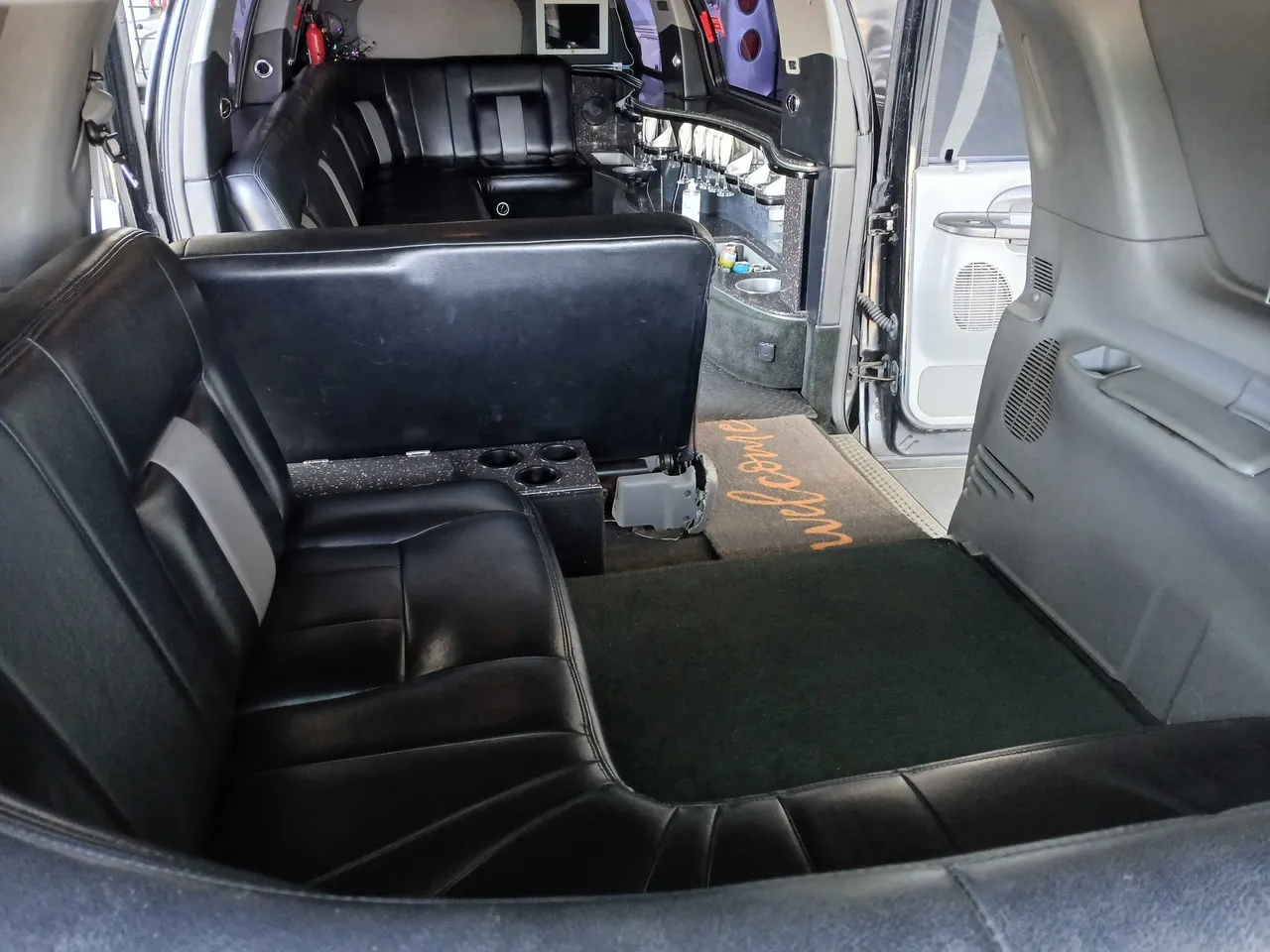 Excursion Limo interior with cup holders for limo rental