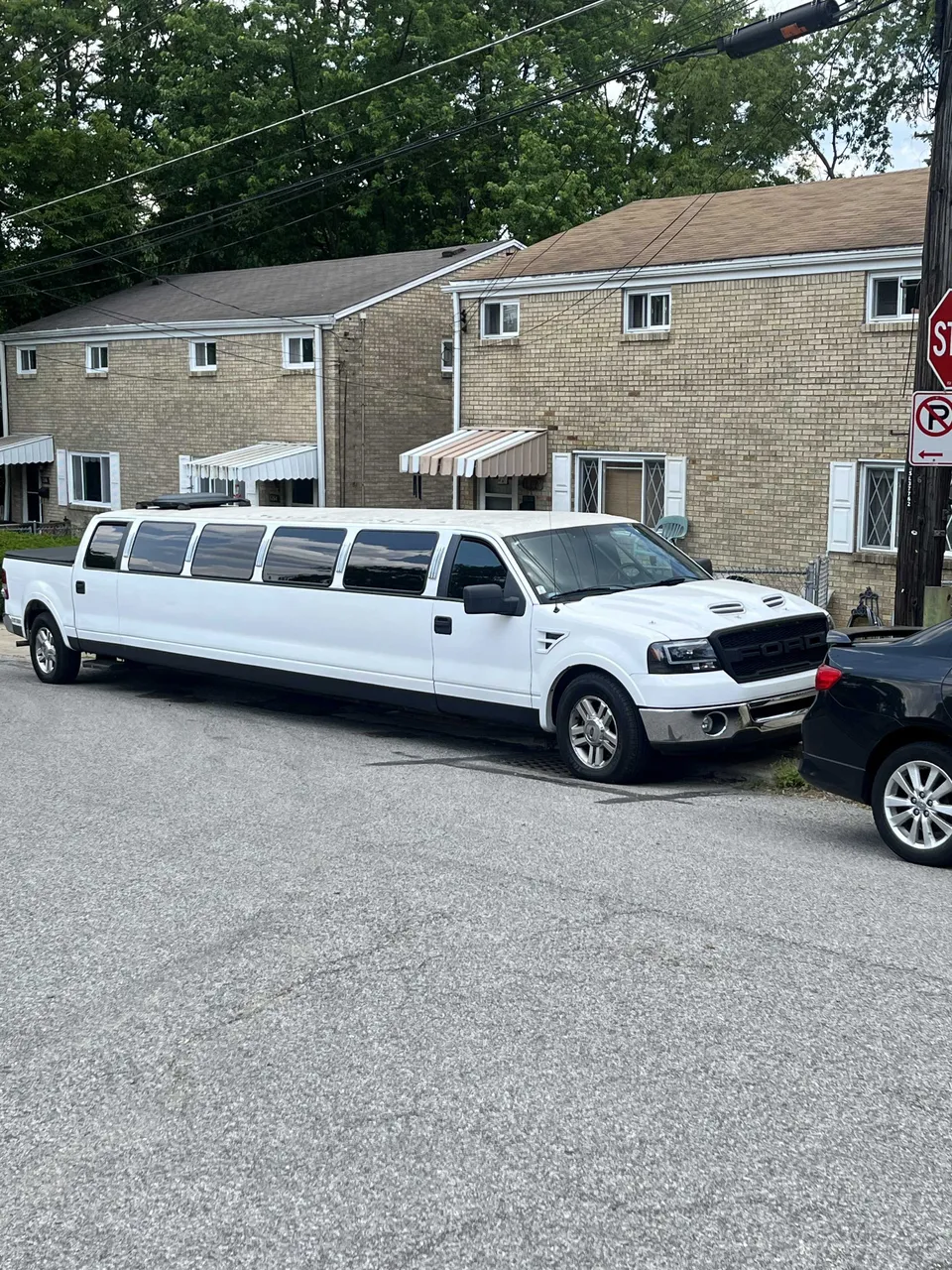 White F150 Limousine exterior for limo rental