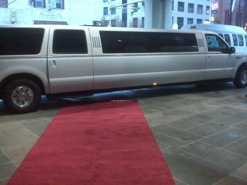 White Ford Excursion Limousine with tinted windows for limo rental