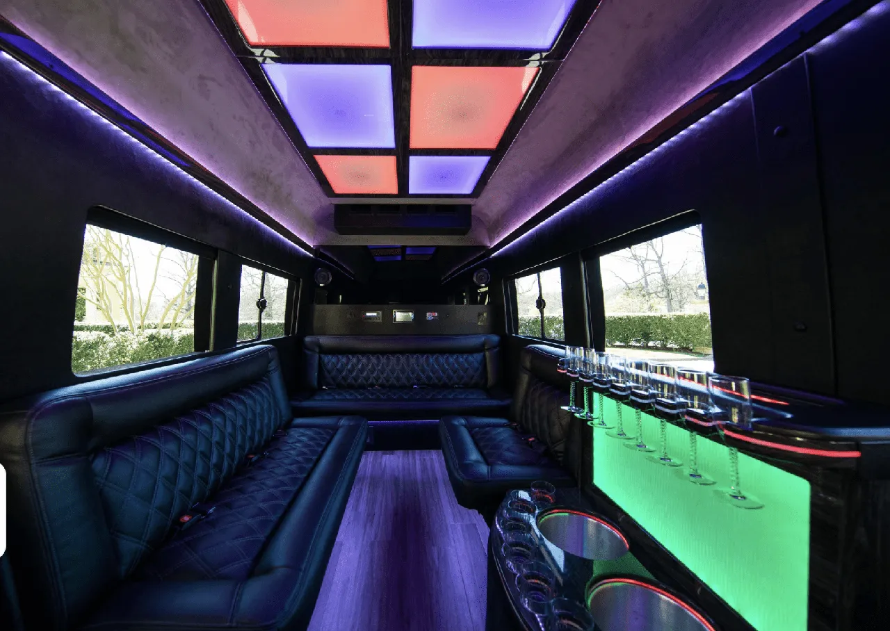 Ford Limousine Van rental, interior view: sofa-style seating, LED accent lighting and LED ceiling lighting