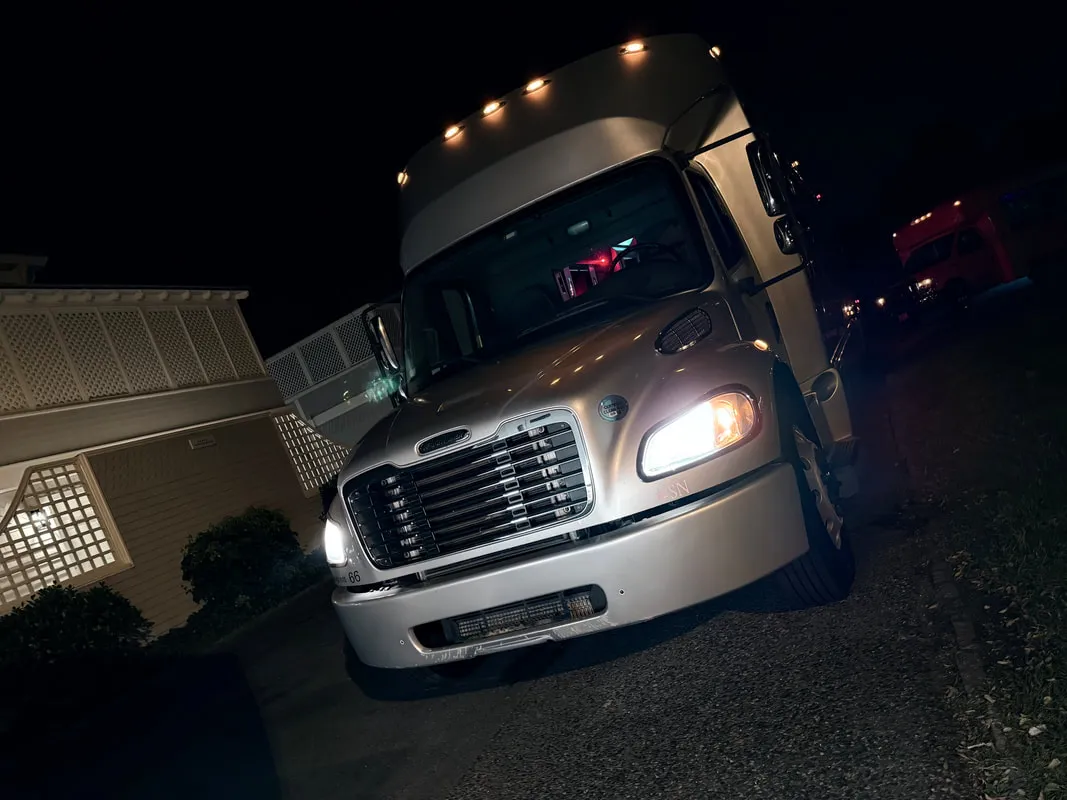 Silver Freightliner Party Bus exterior, photo 3 for limo rental in North Attleboro, MA