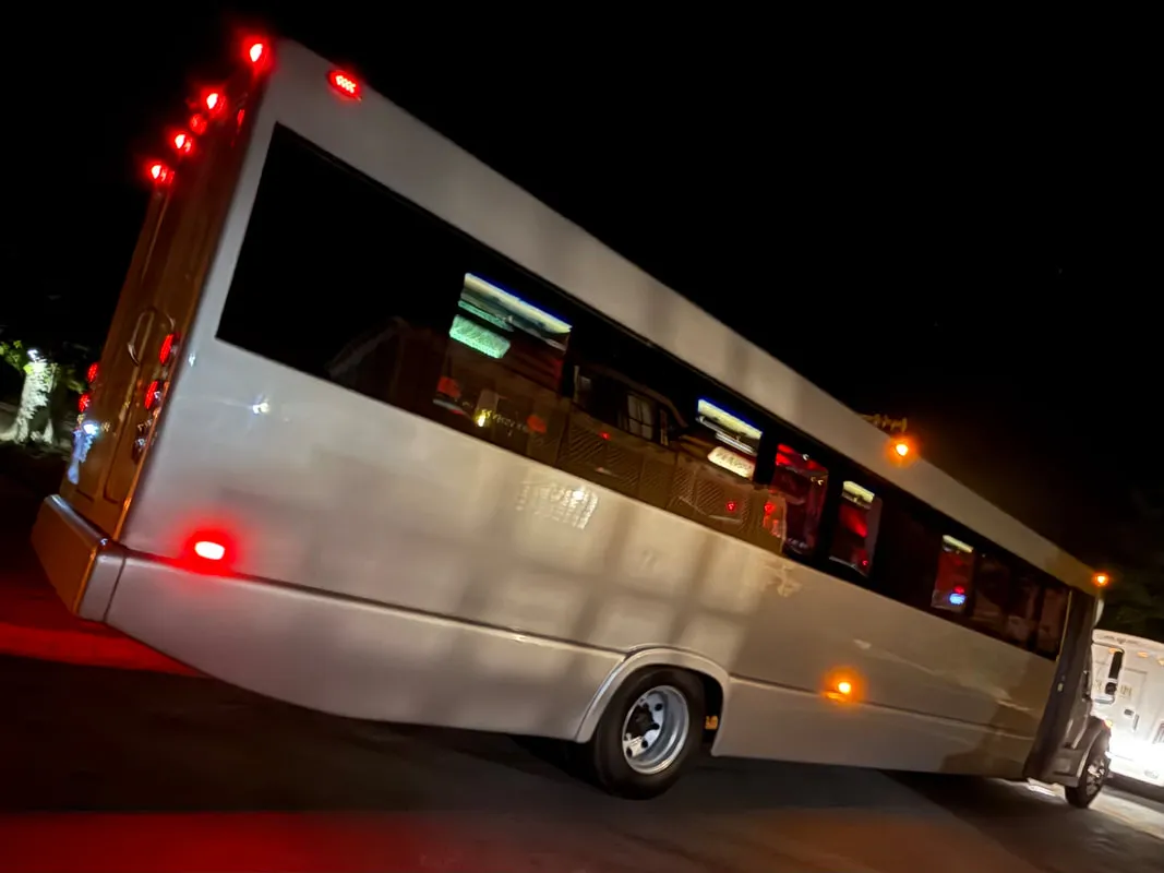 Silver Freightliner Party Bus exterior with tinted windows for limo rental in North Attleboro, MA