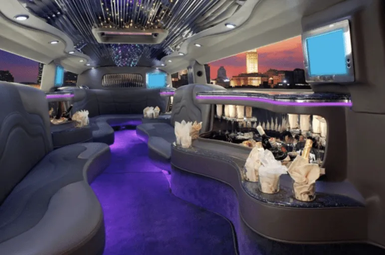 Hummer H2 interior with perimeter lounge seating, LED accent lighting and starlight or fiber-optic ceiling for limo rental