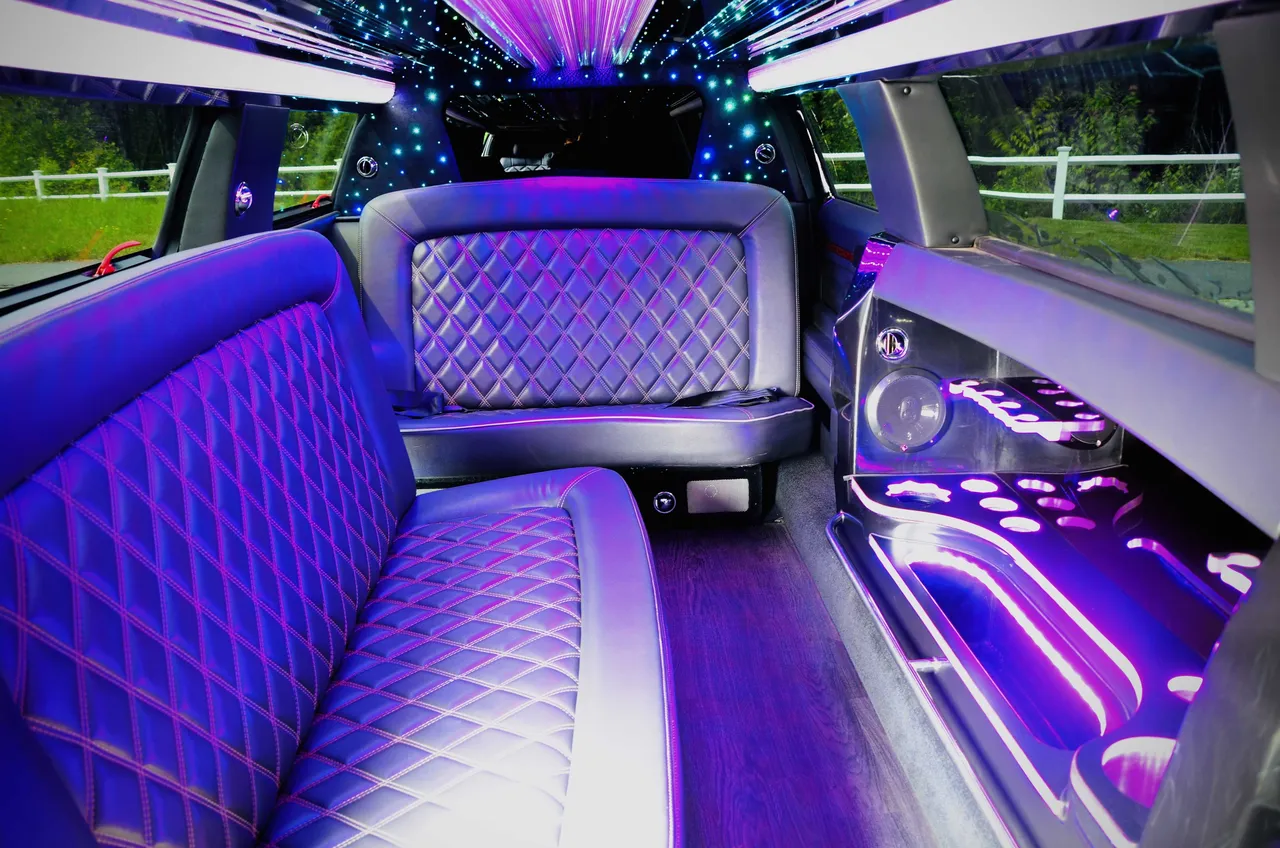 Lincoln MKT Limo interior with LED accent lighting, LED ceiling lighting and starlight or fiber-optic ceiling for limo rental