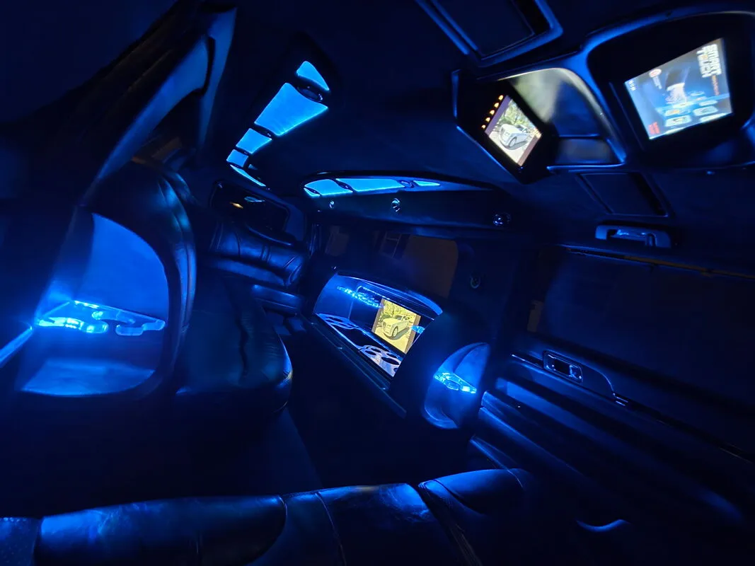 Lincoln MKT Limousine interior with LED accent lighting and TV screens, photo 5 for limo rental