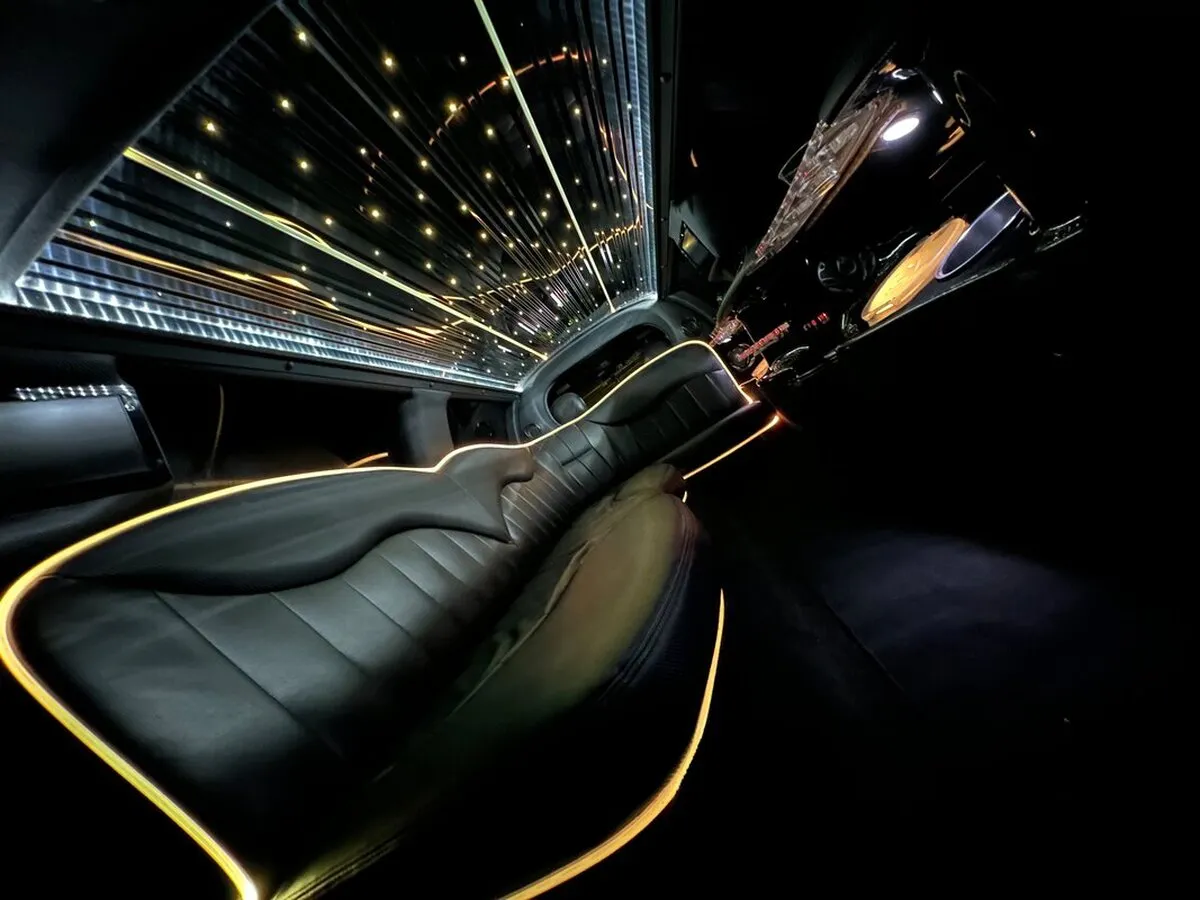 Lincoln Town Car Limousine interior with LED accent lighting, LED ceiling lighting and starlight or fiber-optic ceiling, photo 7 for limo rental in North Attleboro, MA