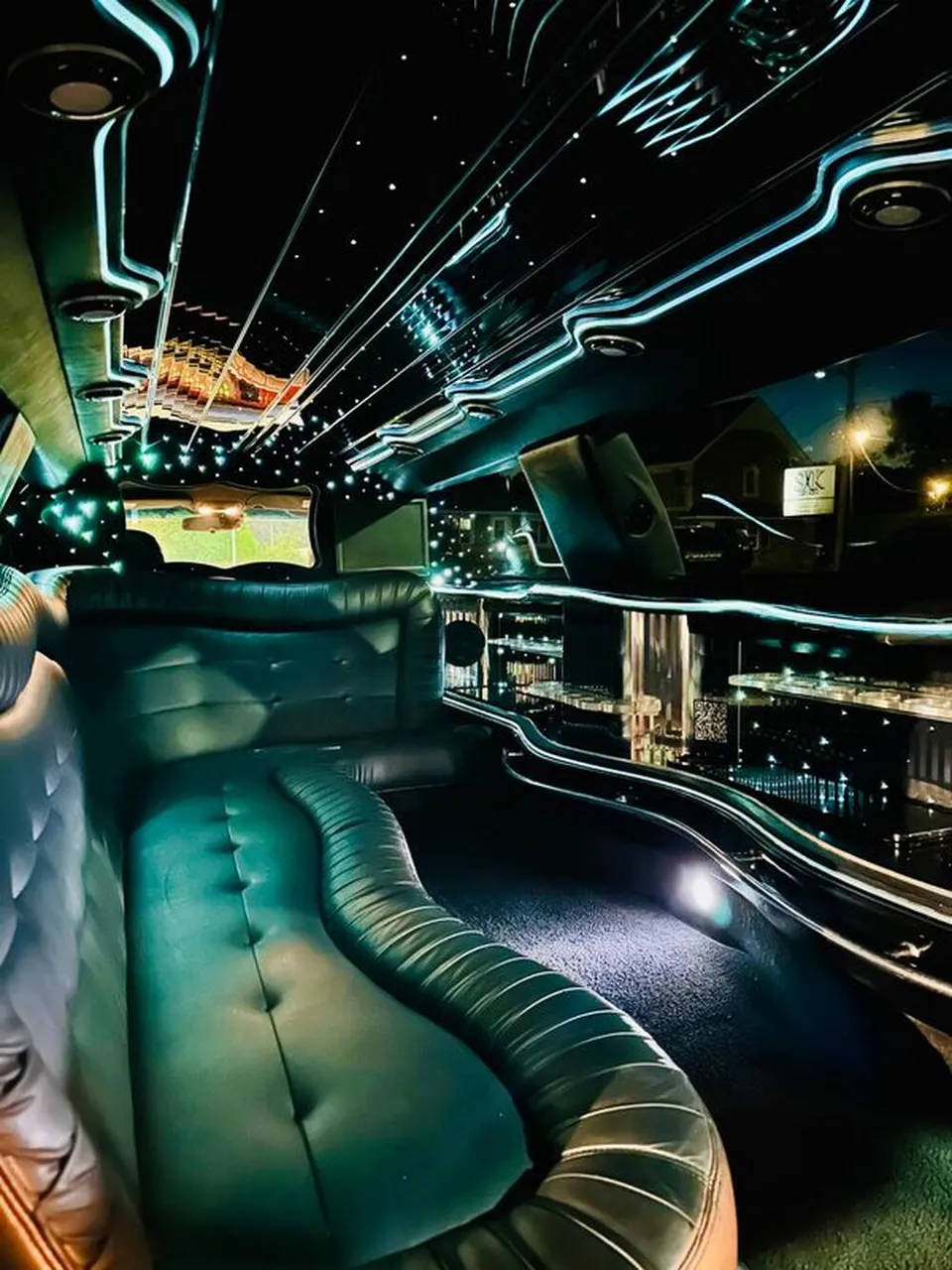 Lincoln Town Car Limousine interior with sofa-style seating, LED accent lighting and starlight or fiber-optic ceiling, photo 11 for limo rental in North Attleboro, MA