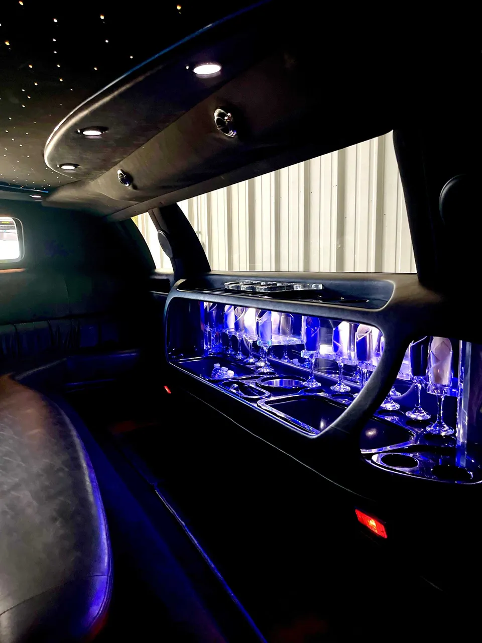 Lincoln Towncar Limo interior with LED accent lighting, starlight or fiber-optic ceiling and glassware holders for limo rental