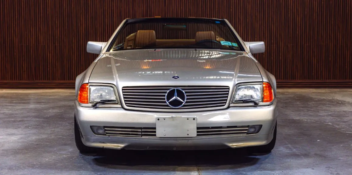 Silver Mercedes Benz SL500 exterior with convertible roof for wedding car rental