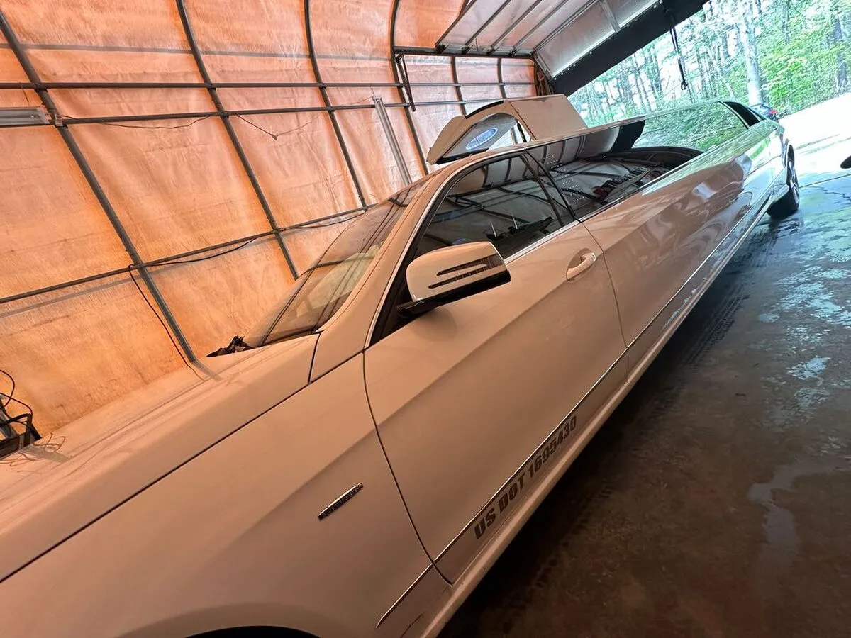 White Mercedes JET Doors Limousine exterior with tinted windows for limo rental