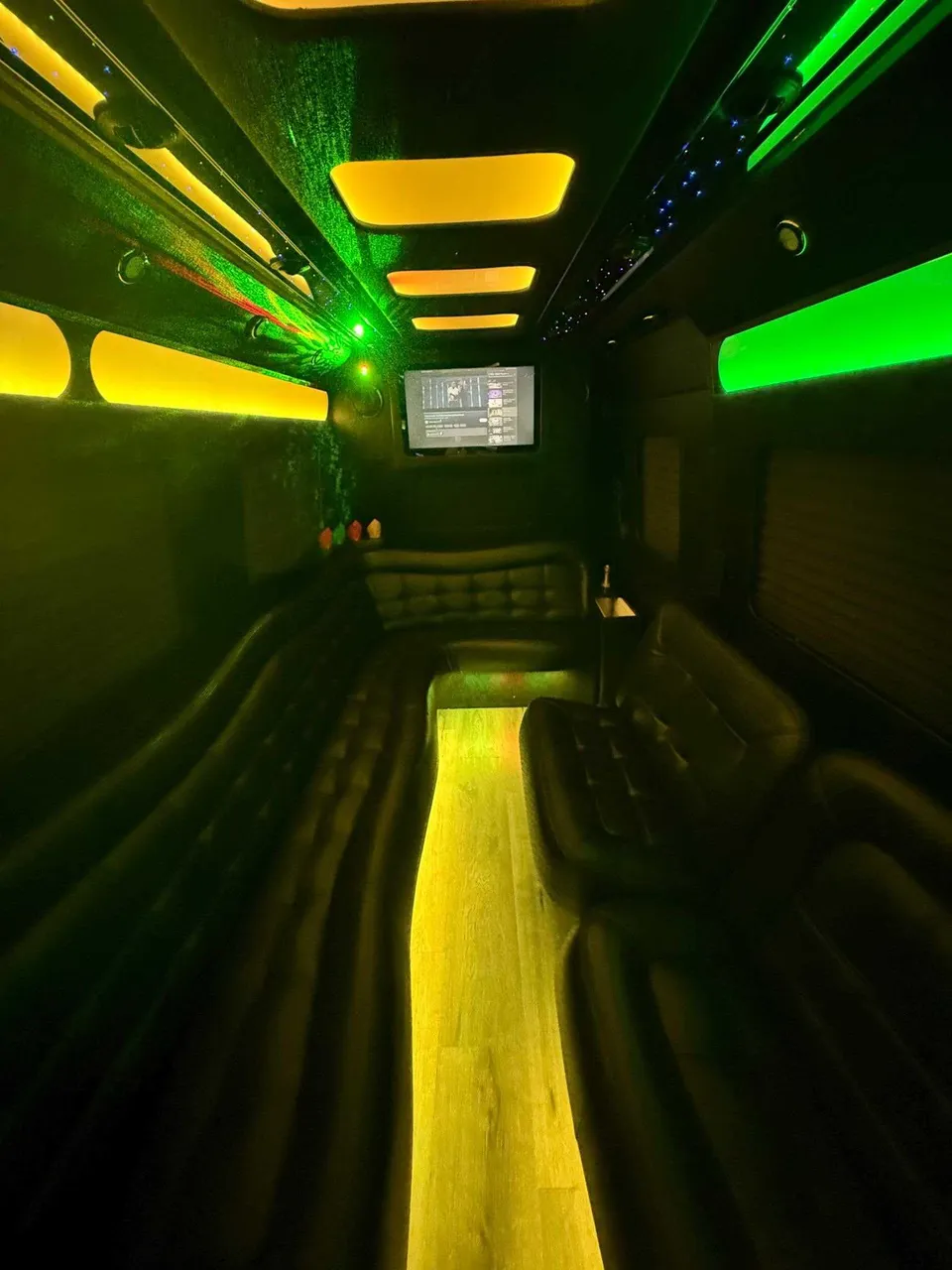 Mercedes-Benz Limousine Sprinter interior with perimeter lounge seating, LED accent lighting and LED ceiling lighting, photo 3 for limo rental in Rosedale, NY