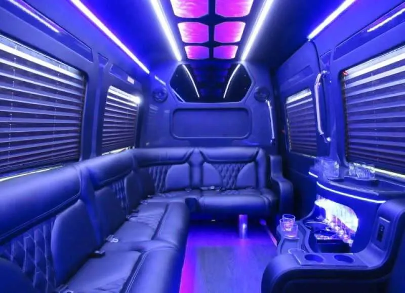 Mercedes-Benz Limousine Sprinter rental, interior view: perimeter lounge seating, window shades and LED accent lighting