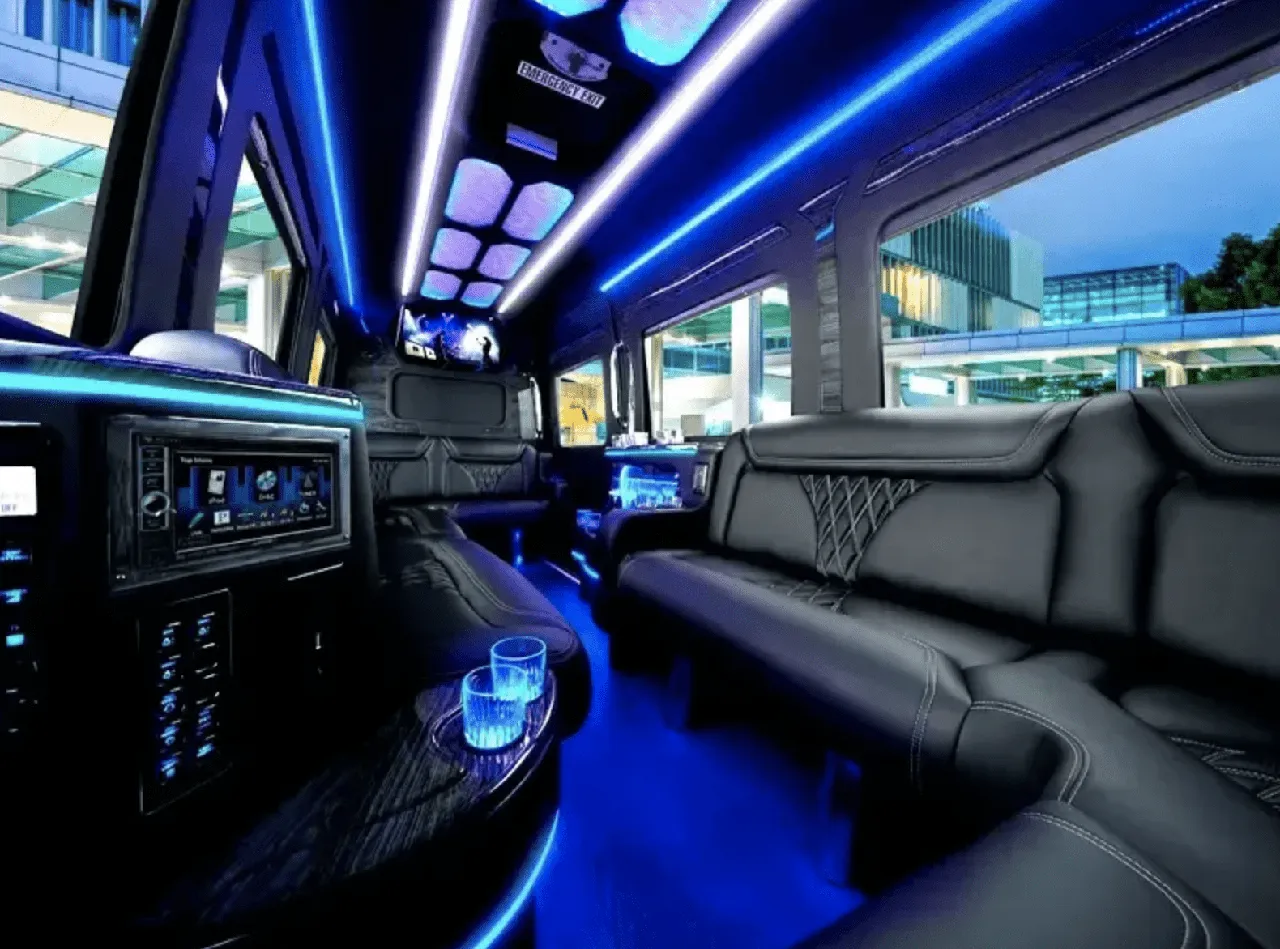 Mercedes-Benz Limousine Sprinter interior with sofa-style seating, LED accent lighting and LED ceiling lighting for limo rental in Fresno County, CA