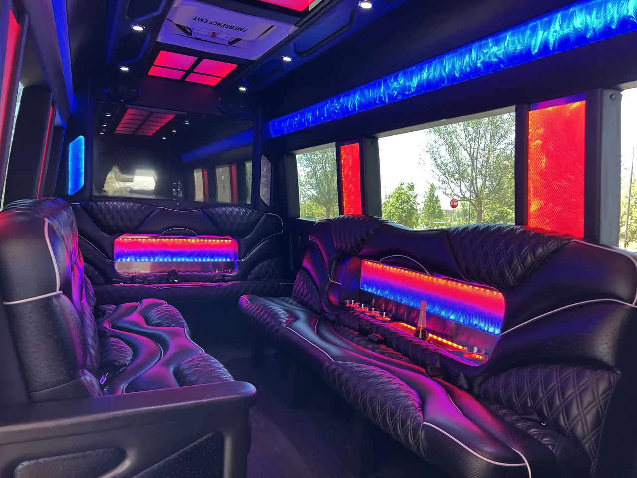 Mercedes-Benz Sprinter Limousine rental, interior view: sofa-style seating, LED accent lighting and LED ceiling lighting #2