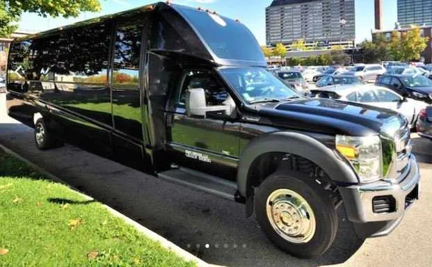 Black Mini Coach Limousine Bus rental, bodywork: tinted windows