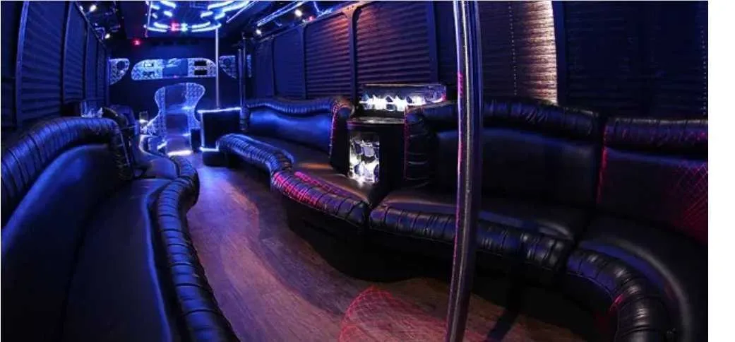 30 Passenger Party Bus limo rental, interior view: perimeter lounge seating, window shades and LED accent lighting