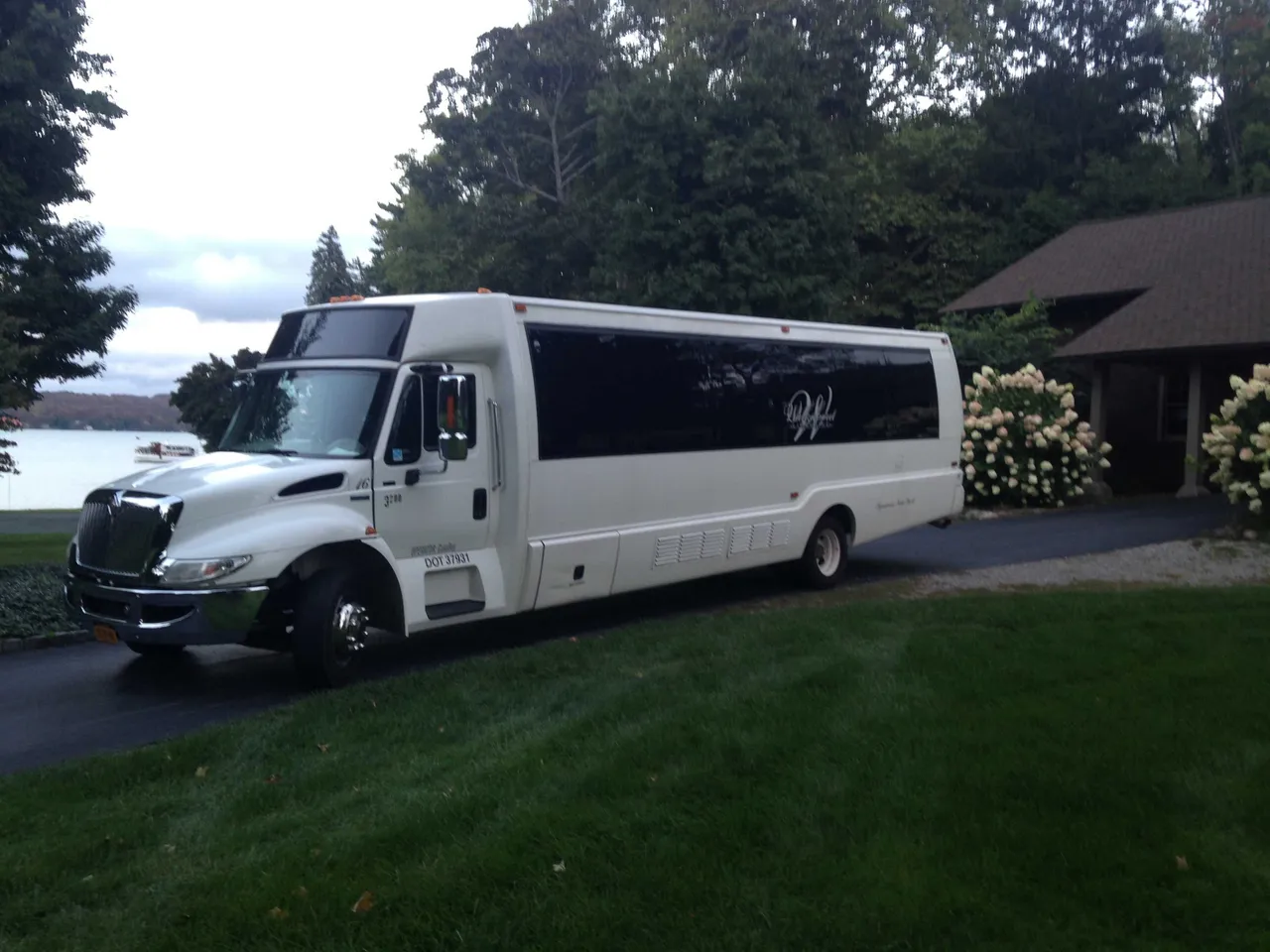 White Party Bus - Dean Martin with tinted windows for limo rental in Manlius, NY