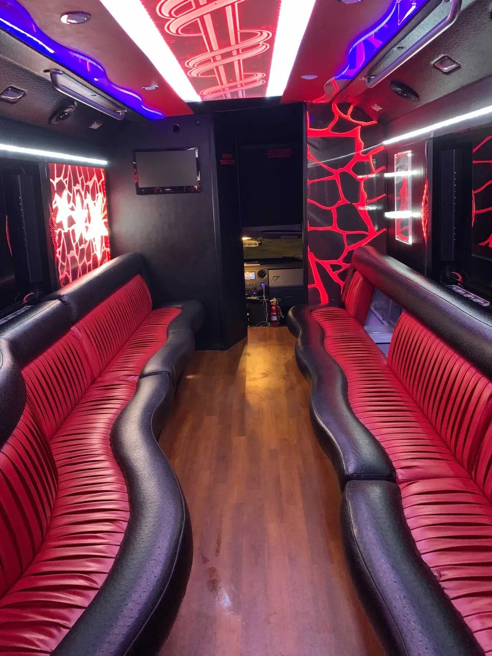 Party Bus - Frank SInatra interior with perimeter lounge seating, LED accent lighting and LED ceiling lighting, photo 2 for limo rental in Apulia Station, NY