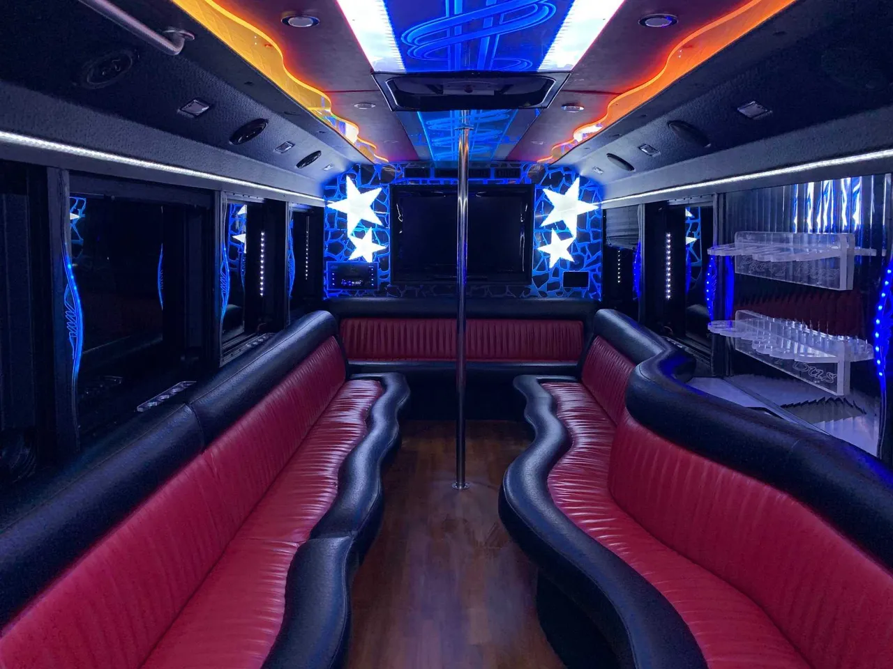 Party Bus - Frank SInatra interior with perimeter lounge seating, LED accent lighting and LED ceiling lighting for limo rental in Apulia Station, NY