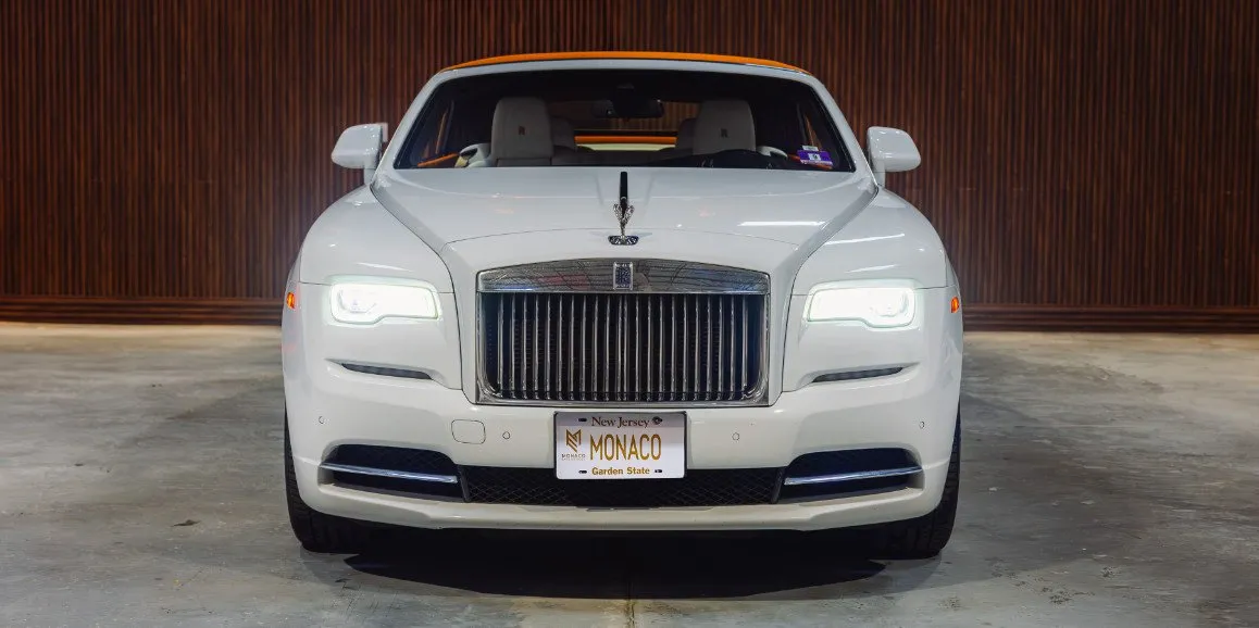 White Rolls Royce Dawn (Hermes) exterior with convertible roof for wedding car rental