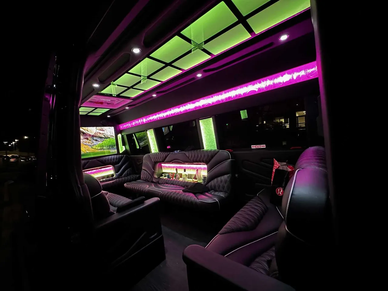 13 Passenger Sprinter Limousine rental, interior view: sofa-style seating, captain's chairs and LED accent lighting