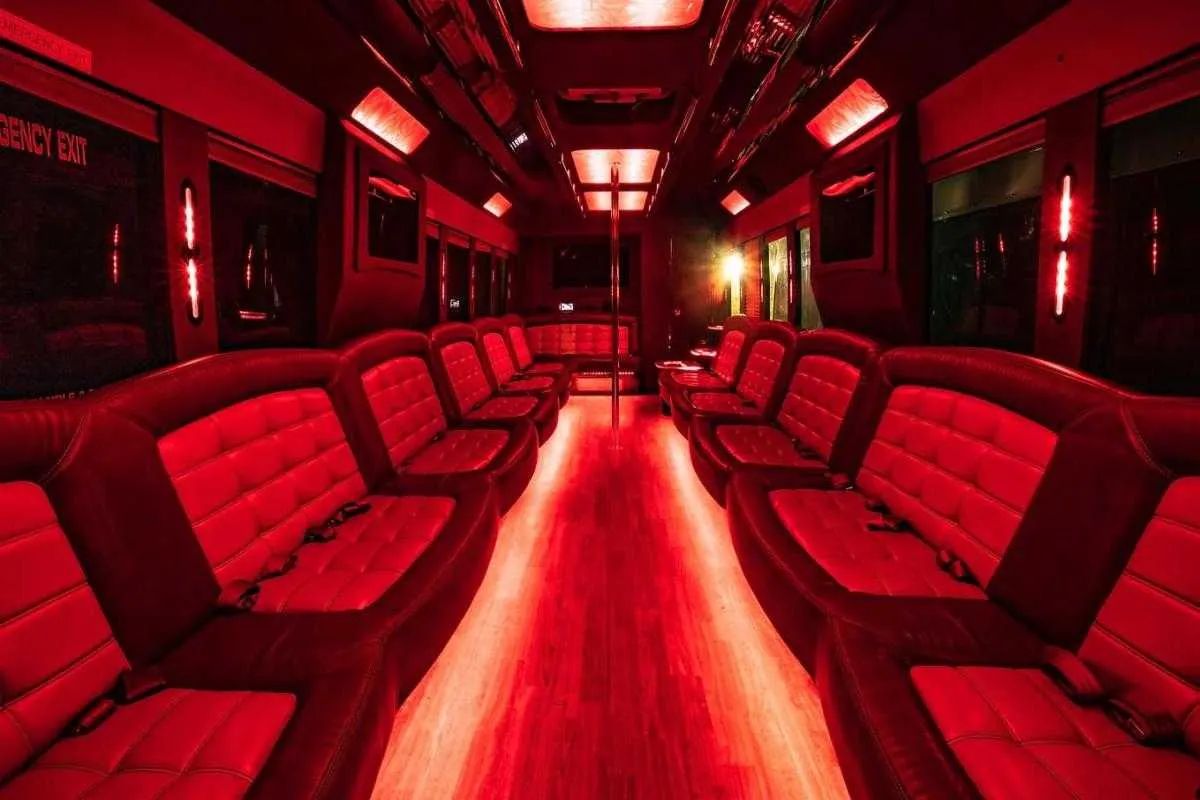 Tiffany Party Bus limo rental, interior view: perimeter lounge seating, LED accent lighting and LED ceiling lighting